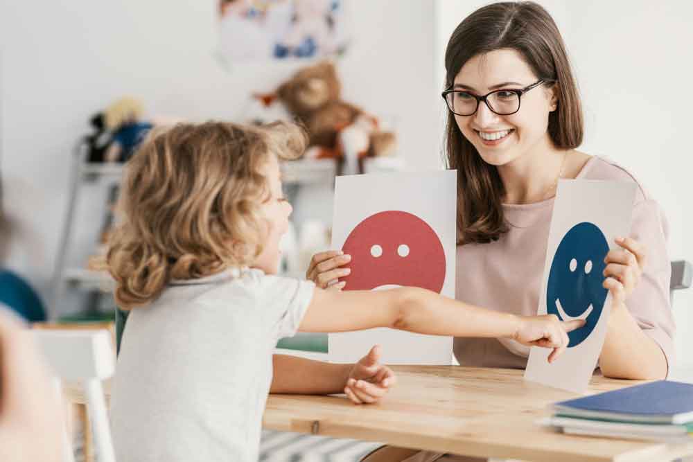 Emotion emoticons used by a psychologist during a therapy session with a child with an autism spectrum disorder.