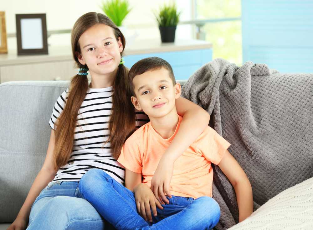 Brother and sister on couch